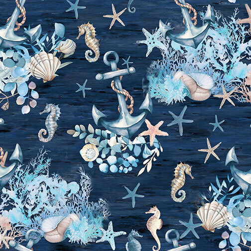 An indigo fabric with scattered anchors, seahorses, starfish, seashells, coral, and leafy accents.
