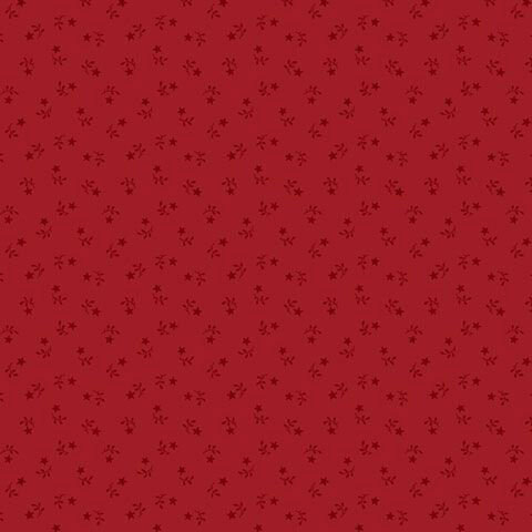 Patriotic red fabric with a tossed pattern of tonal stars and leaves.