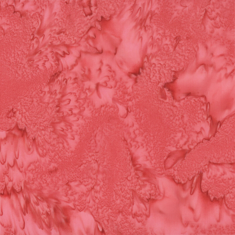Marbled and mottled rouge red batik fabric.