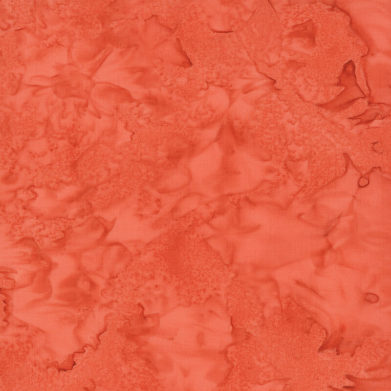 Marbled and mottled marmalade orange batik fabric.