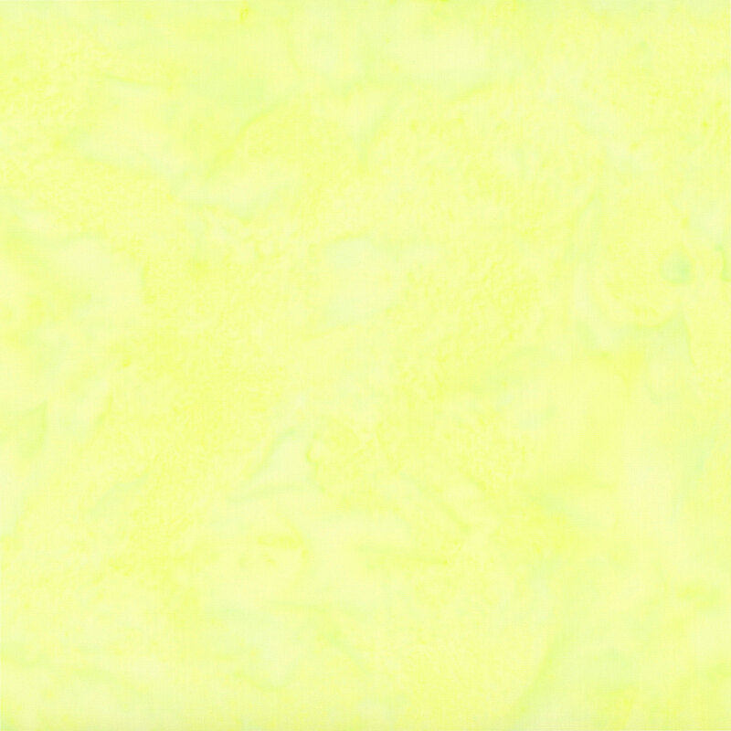 Marbled and mottled bright cornsilk yellow batik fabric.