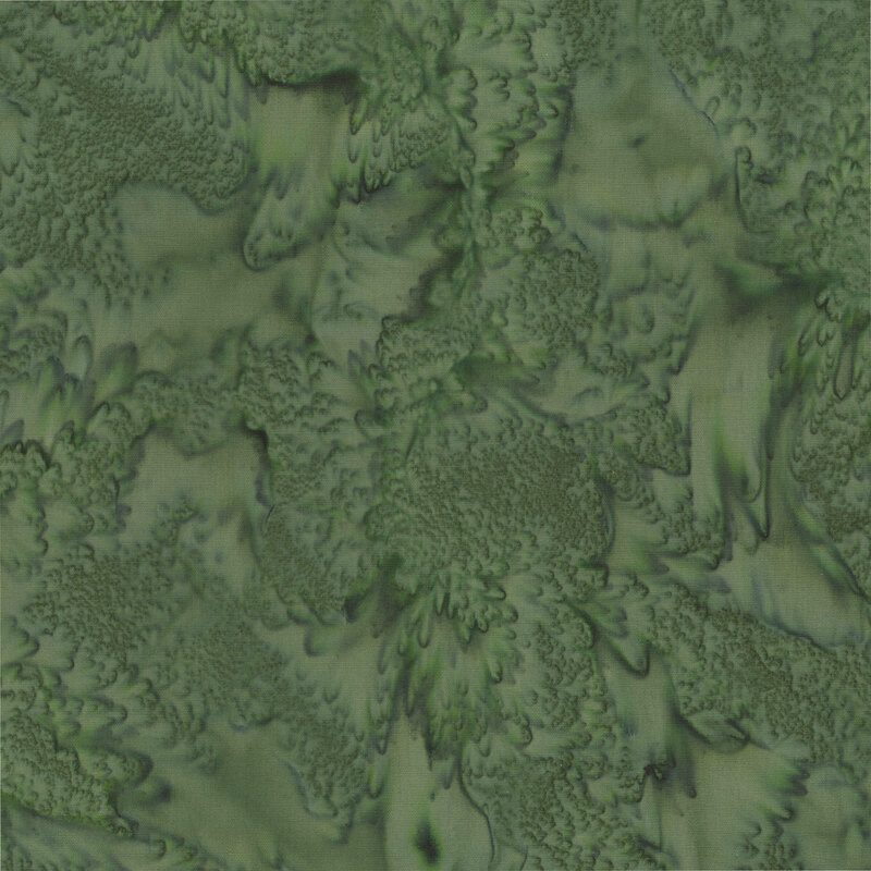 Marbled and mottled forest green batik fabric.