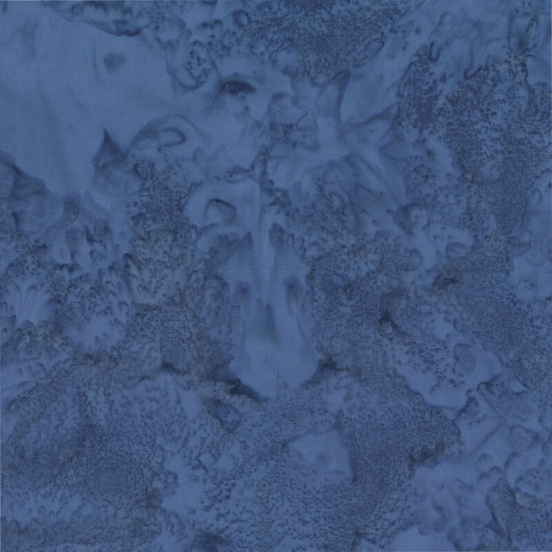 Marbled and mottled cadet blue batik fabric.