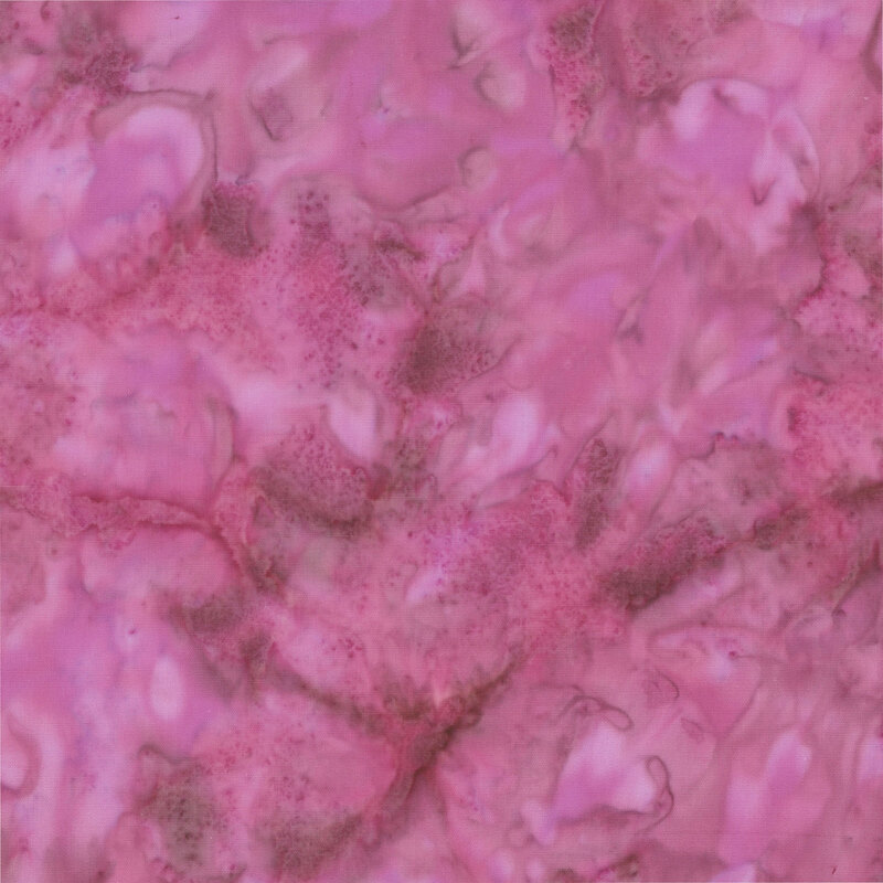 Marbled and mottled purplish pink batik fabric.