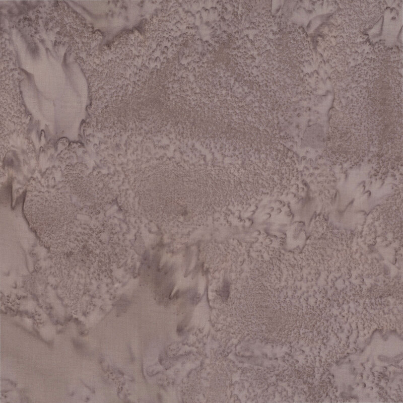 Marbled and mottled mousy gray batik fabric.