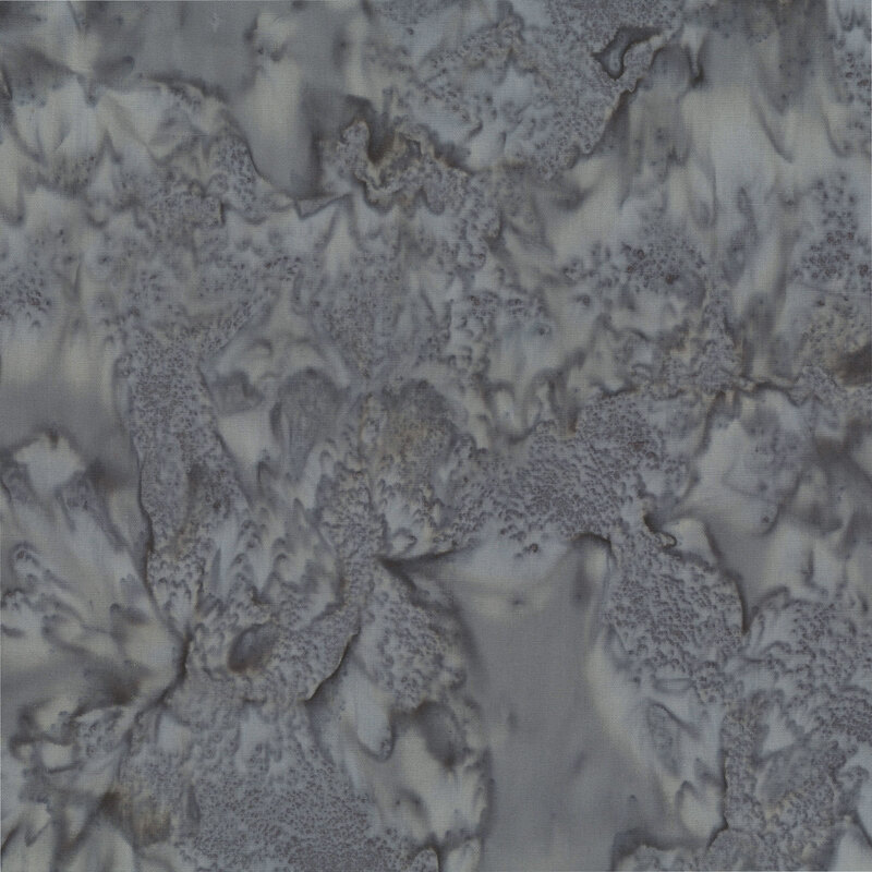 Marbled and mottled dark gray batik fabric.