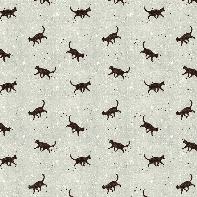 black cat silhouettes scattered among tiny white stars and black speckles against a softly textured cool sage background.