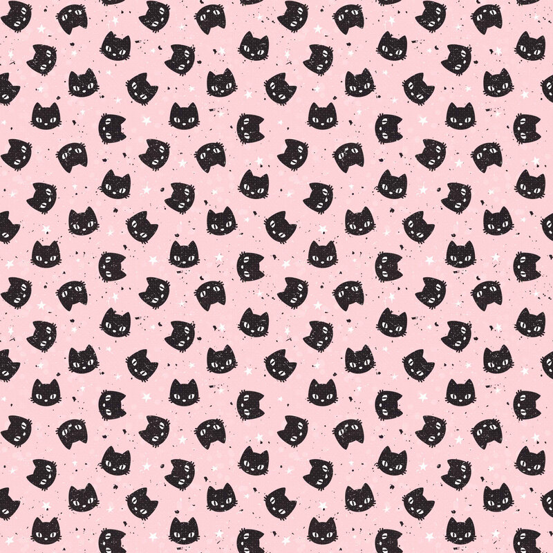 scattered black cat faces with expressive white eyes scattered across a soft pink background, accented with tiny white stars and black speckles