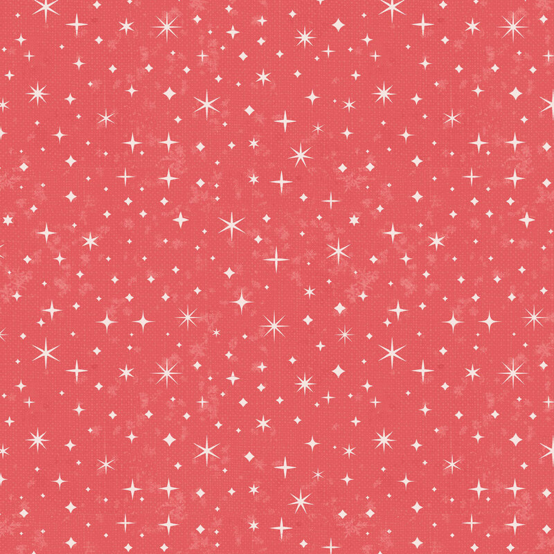 A salmon red fabric with scattered stars.