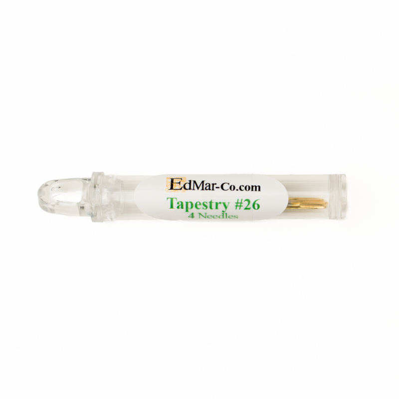 Plastic container holding 4 size 26 tapestry needles from Edmar Co. isolated on a white background.