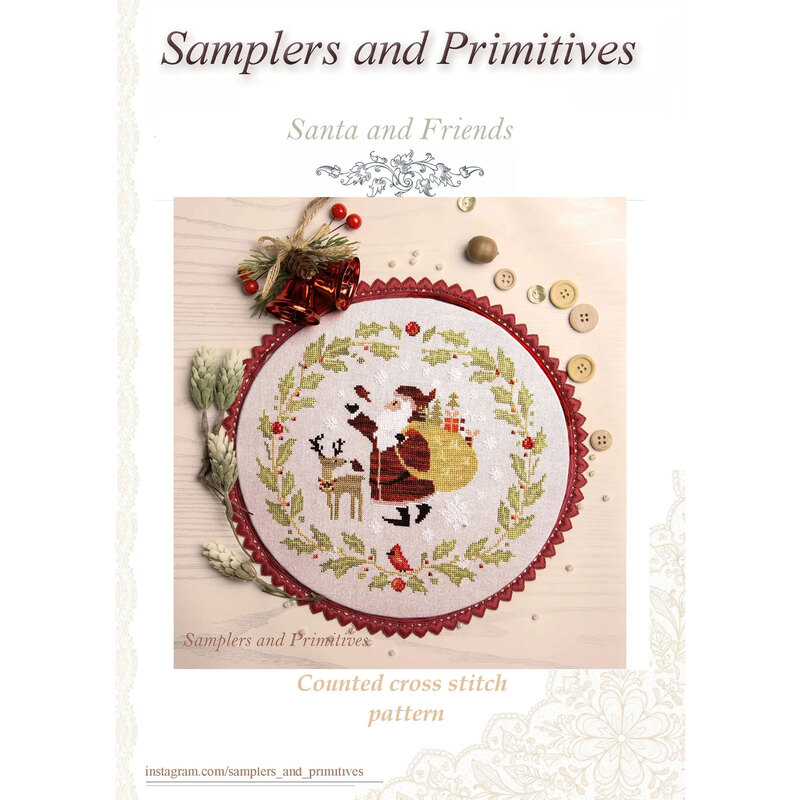 Front cover of the Santa and Friends cross stitch pattern in a circle hoop next to buttons, acorns, pine boughs, and bells.