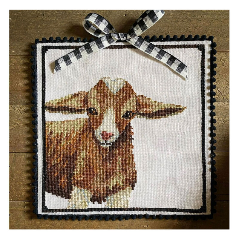 A stitched mock up of the pattern, finished with a bow. 