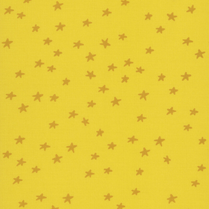 yellow fabric featuring golden stars.
