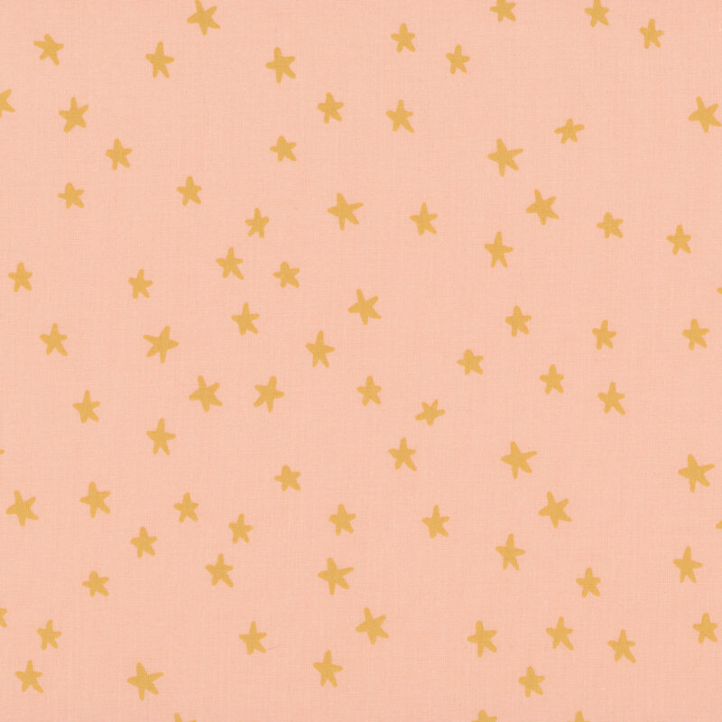 peach fabric featuring brown stars.