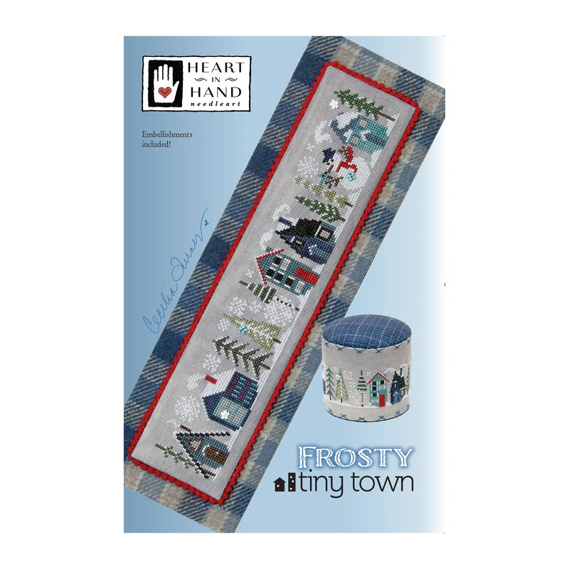 Front cover of the Frosty Tiny Town finished pattern isolated on a blue background.