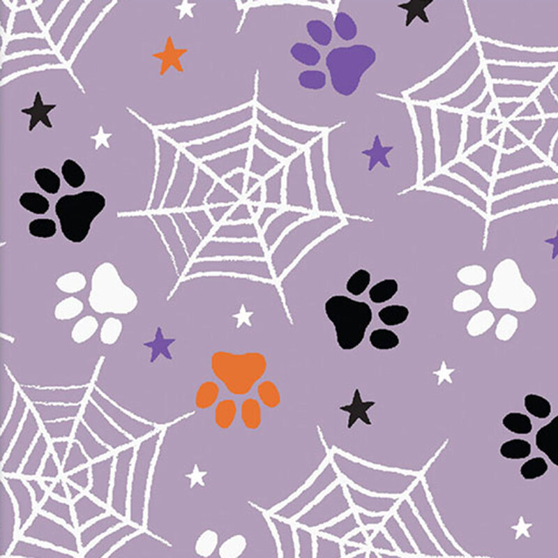 Purple fabric with a tossed pattern of dog paw prints, spiderwebs, and stars.