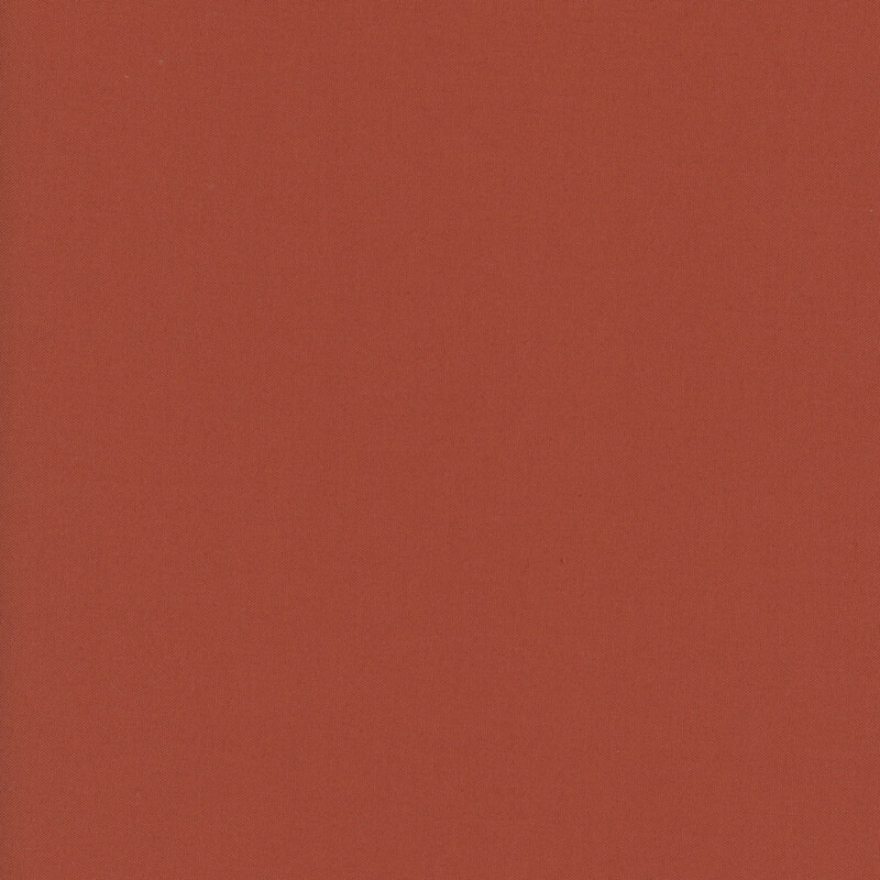 Solid cinnamon red fabric swatch.