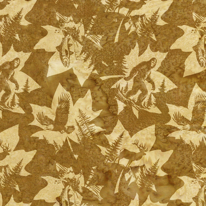 Mottled bronze batik fabric with a tossed pattern of leaves accented with Pacific Northwest-inspired motifs, including salmon, Bigfoot, and eagles.