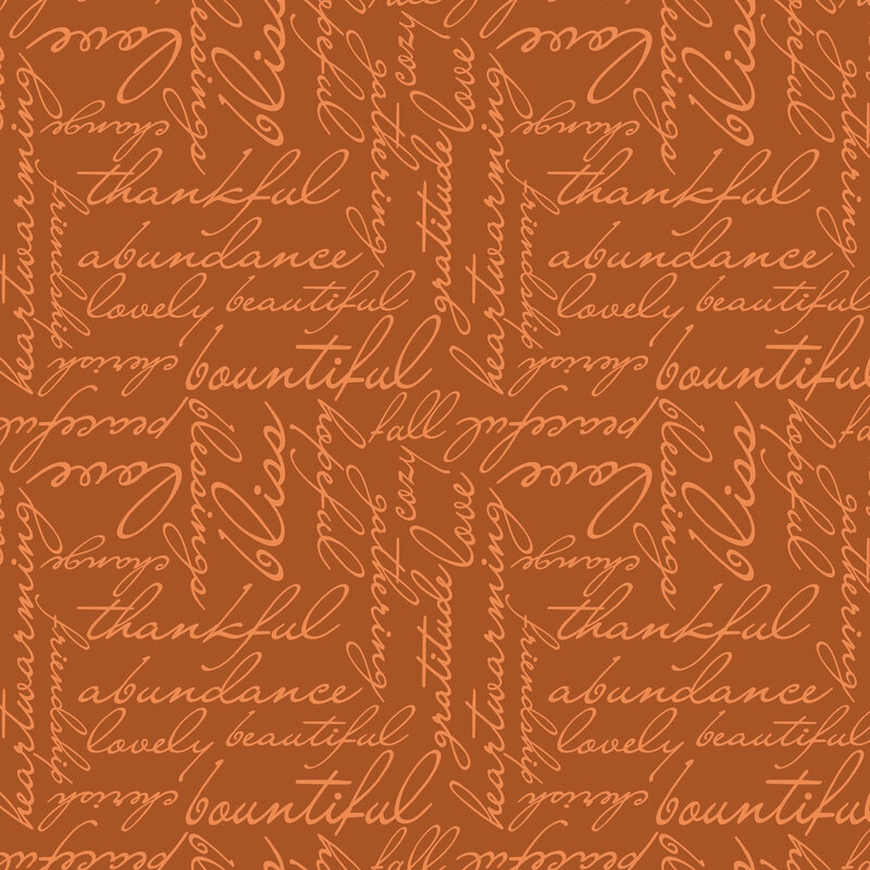 Orange fabric with autumn-themed cursive text.