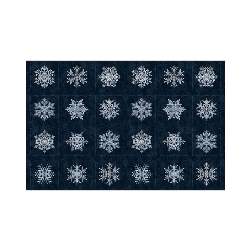 Midnight blue fabric with a balanced block pattern of powder blue snowflakes.