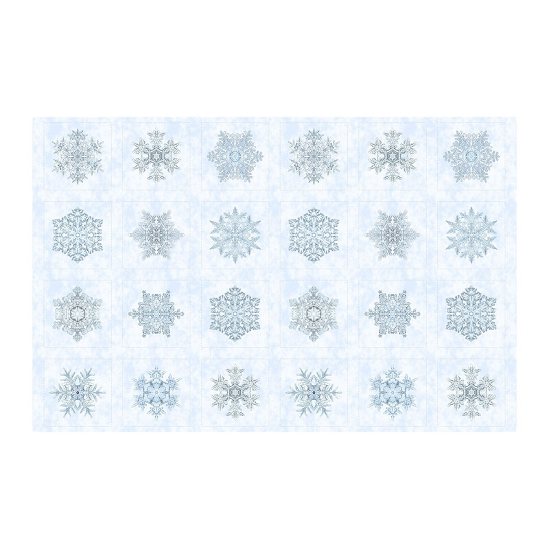 Powder blue fabric with a balanced block pattern of blue snowflakes.