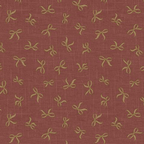Textured dark rose fabric with a tossed pattern of golden bows.