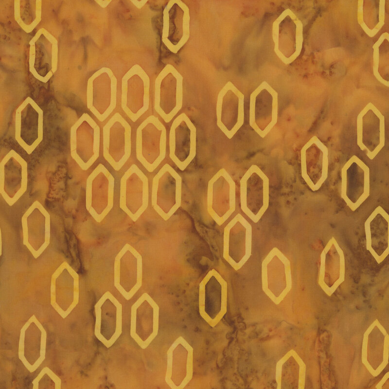 This mottled honey yellow batik fabric features tonal hexagonal shapes reminiscent of a bee hive. 
