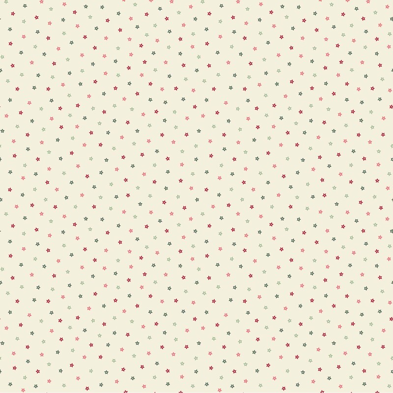 fabric featuring tiny scattered stars in shades of red, pink, sage, and evergreen against a soft cream background.