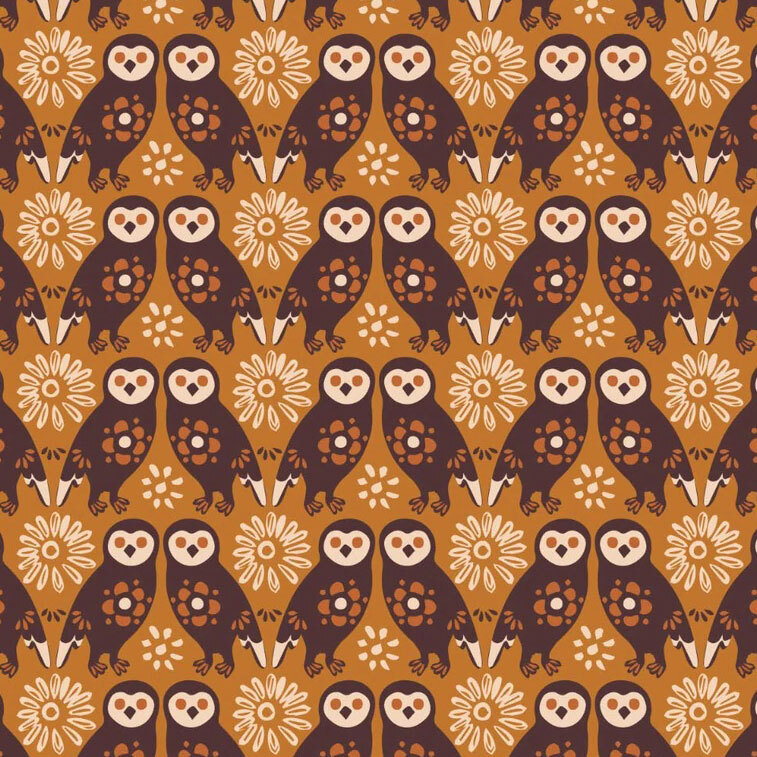 repeating pairs of stylized brown owls accented with floral motifs and geometric details on a warm gingersnap background.