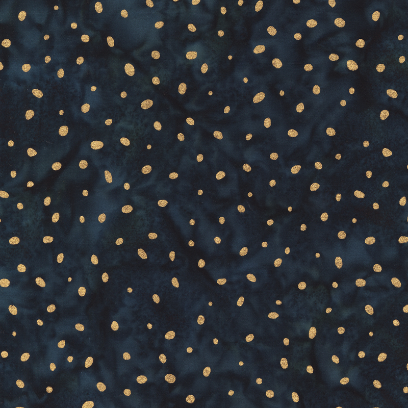A deep charcoal batik fabric with irregular metallic gold dots scattered across a mottled background.