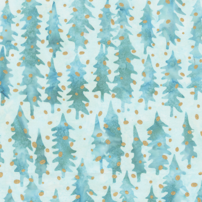 A pale aqua batik fabric with blue and teal evergreen tree silhouettes and metallic gold dots.