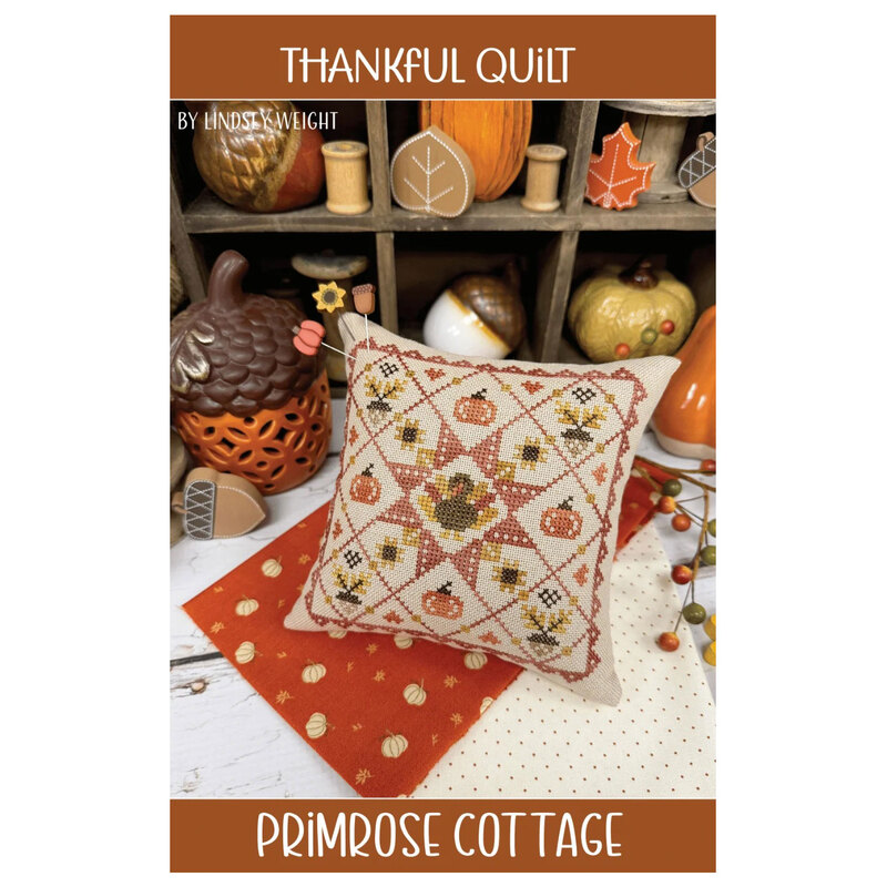 The front of the pattern showing the finished project pillow staged amongst coordinating Autumn decor.
