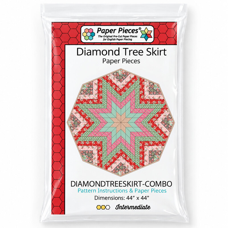 Octagonal fabric tree skirt with a large layered starburst design made from red, pink, mint green, beige, and floral diamond pieces.