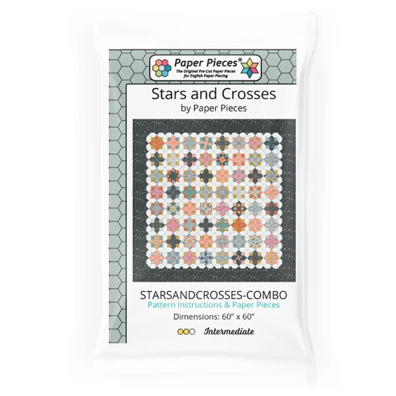 Colorful patchwork quilt with repeating geometric star and cross blocks created from floral, striped, and patterned fabrics.