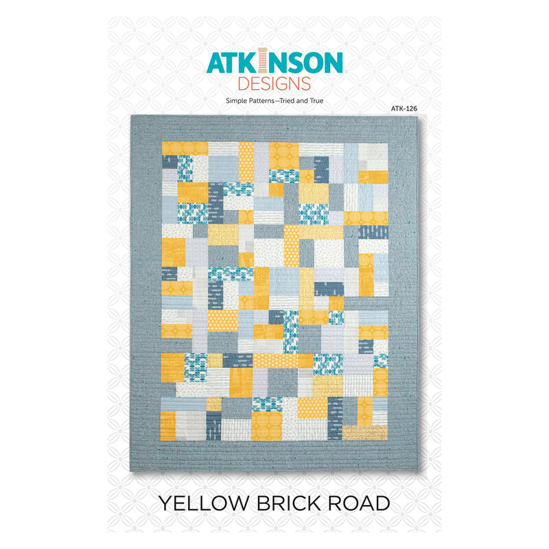Front cover of the Yellow Brick Road pattern, showing a completed version of the quilt in yellow and dusty blue fabrics.