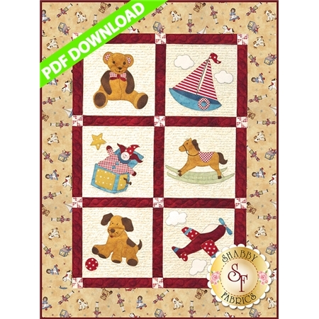 A colorful quilt design featuring six squares, each with a playful appliqué: a teddy bear, a sailboat, a clown on a rocking horse, a dog, a star, and a toy airplane, all set against a light-colored background with a decorative border. Includes a banner that says PDF Download in green and a logo for Shabby Fabrics in the bottom right corner.