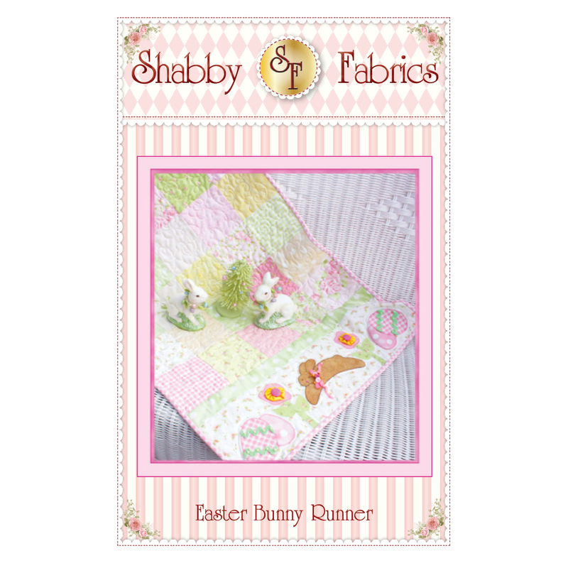 The front of the Easter Bunny Runner pattern by Shabby Fabrics showing the finished runner with both patchwork and applique.