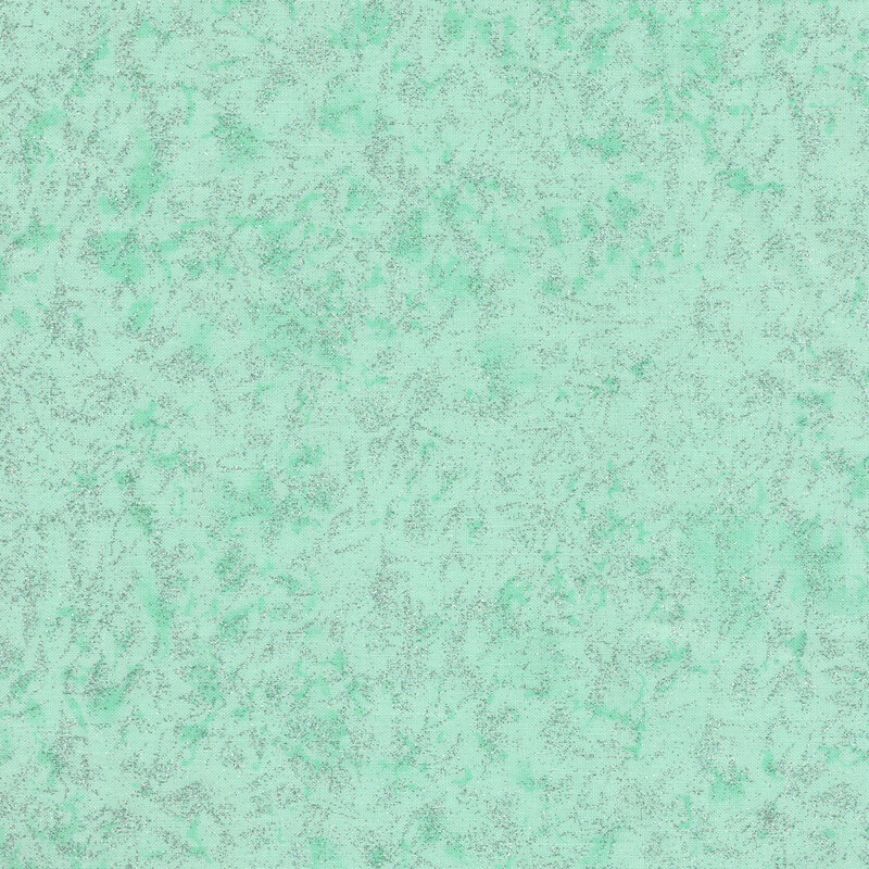 Tonal seafoam green fabric features mottled design with metallic glitter accents