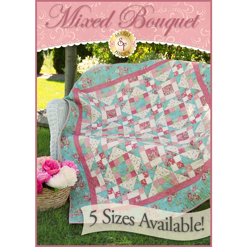 Turquoise and pink patchwork quilt from squares and half-square triangles. 