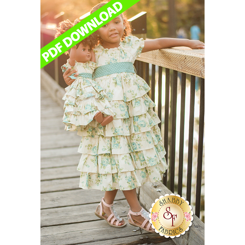 A little girl and her doll wearing the Dolly & Me Petticoat Dresses.