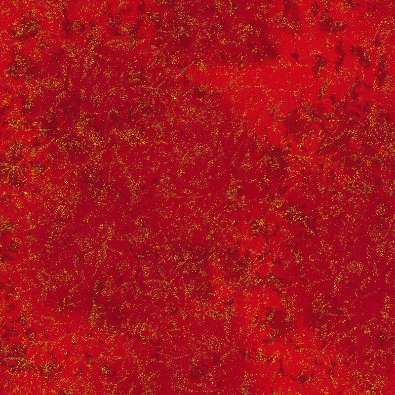 Tonal red fabric features mottled design with gold glitter accents