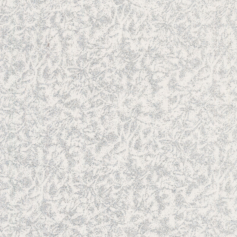 Tonal light cream features mottled design with metallic glitter accents