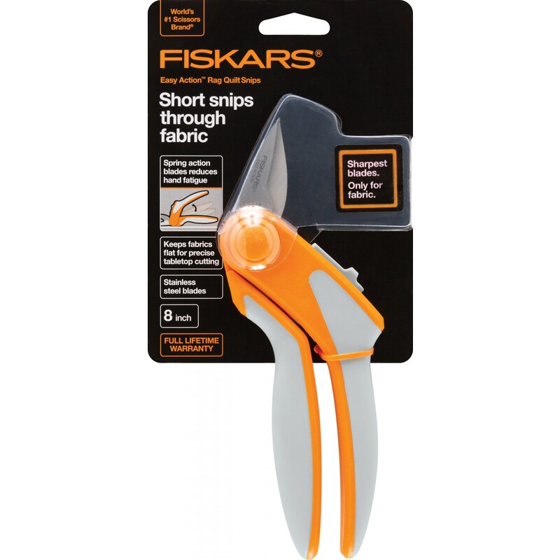 Fiskars fabric snips with orange and gray handle, designed for easy cutting through fabric.