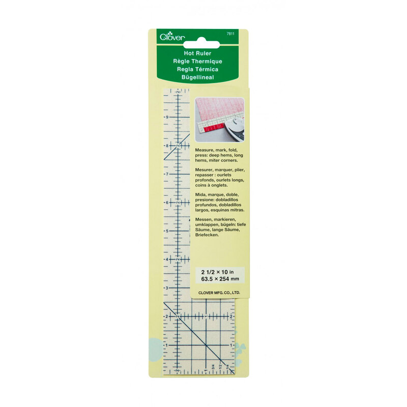 A ruler package, featuring usage instructions and product info, and a beige ruler with black markings inside.