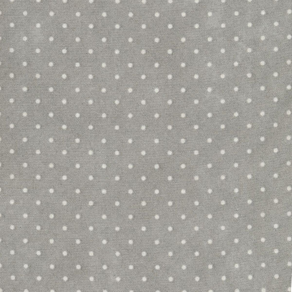 mottled gray fabric with tiny cream polka dots