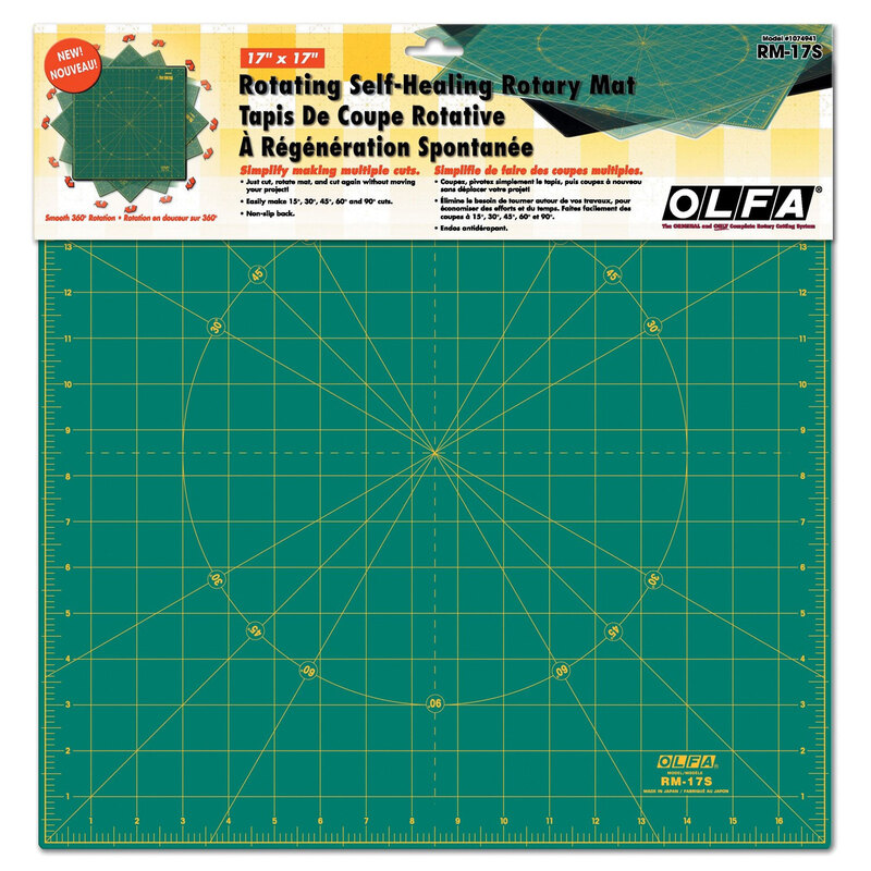 Green self-healing rotary cutting mat with grid lines and circular markings, 17” x 17”.