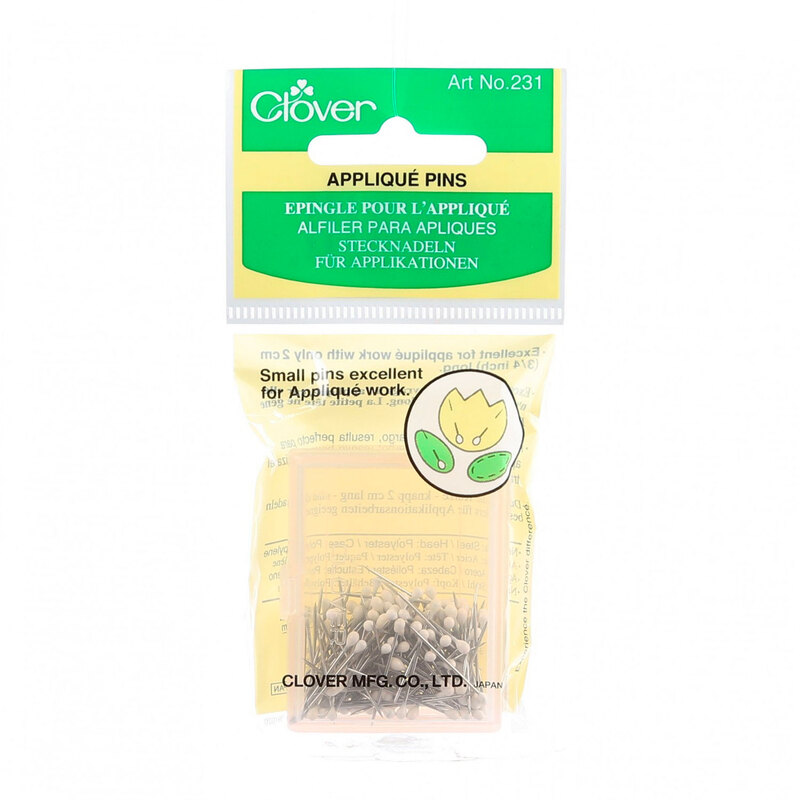 Clear plastic package containing Clover brand appliqué pins, ideal for crafting and sewing projects.