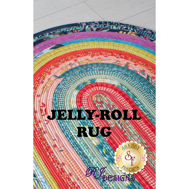 The front of the Jelly Roll Rug pattern featuring the finished rug displayed on a white wooden floor.