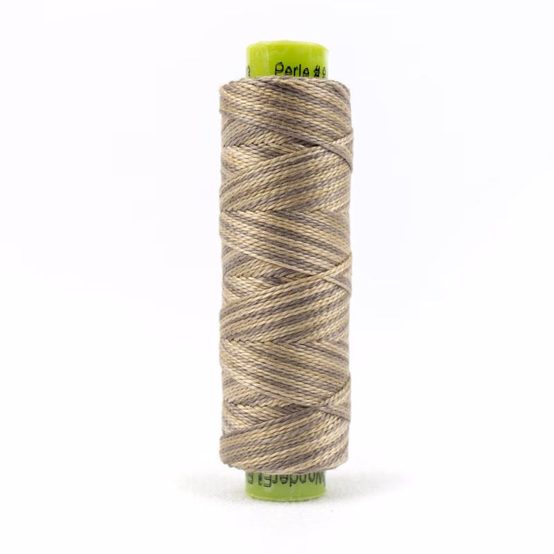 A spool of WonderFil Eleganza #8 EZM03 Sand Dollar thread on a white background
