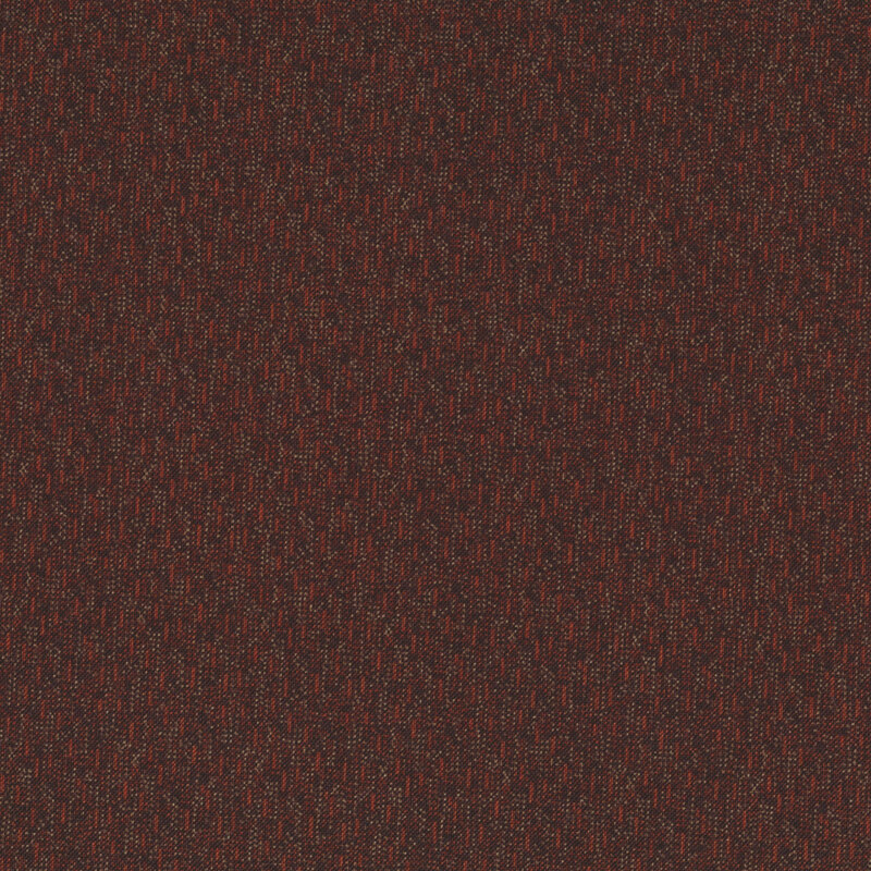 A textured fabric surface in dark red with subtle patterns.